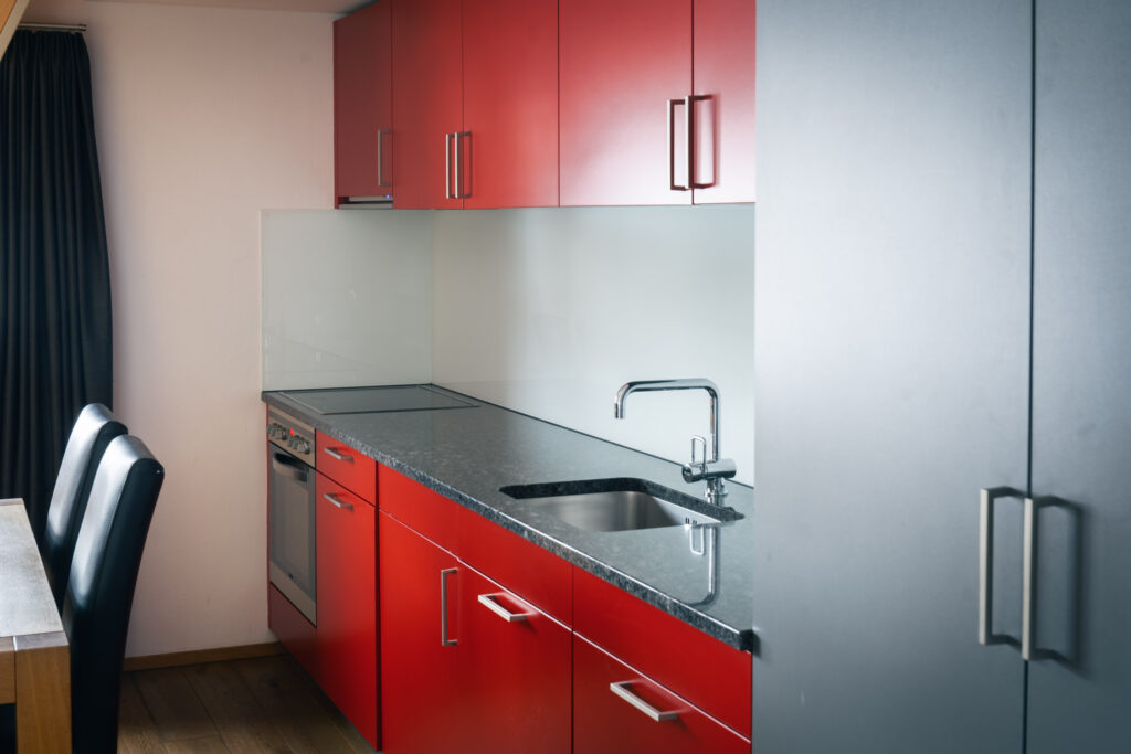 Fully equipped kitchen in the holiday apartment at Hotel Alpina Brigels