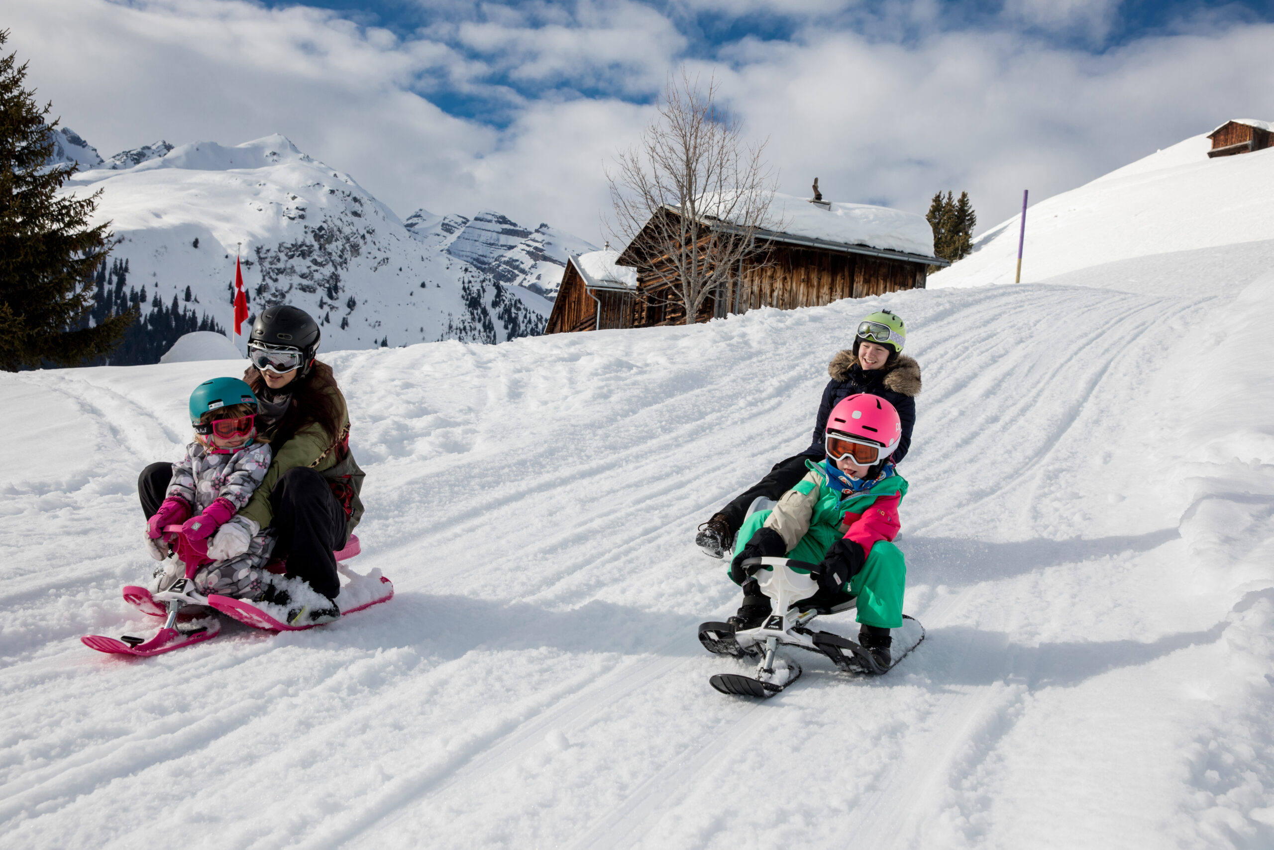 Sledding with the whole family in the Brigels ski area