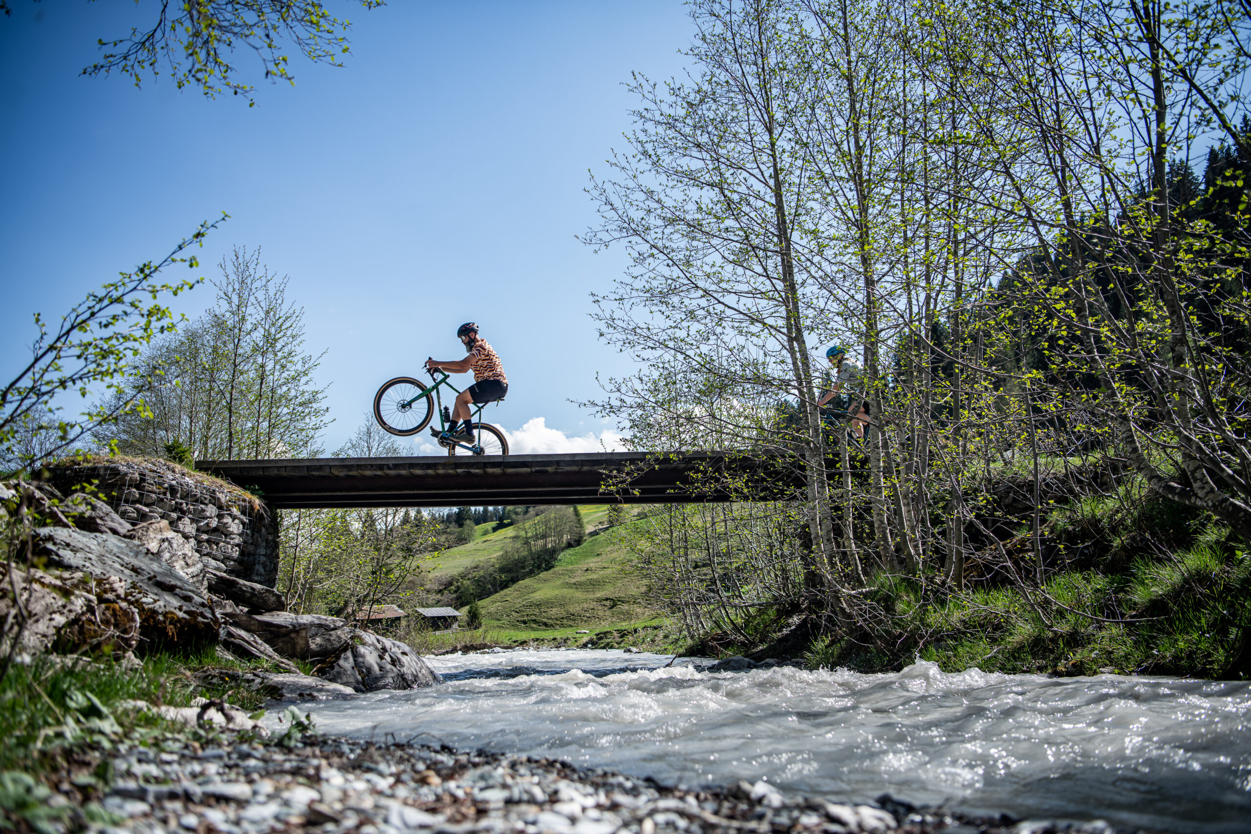 Gravel biking on a bridge in Brigels