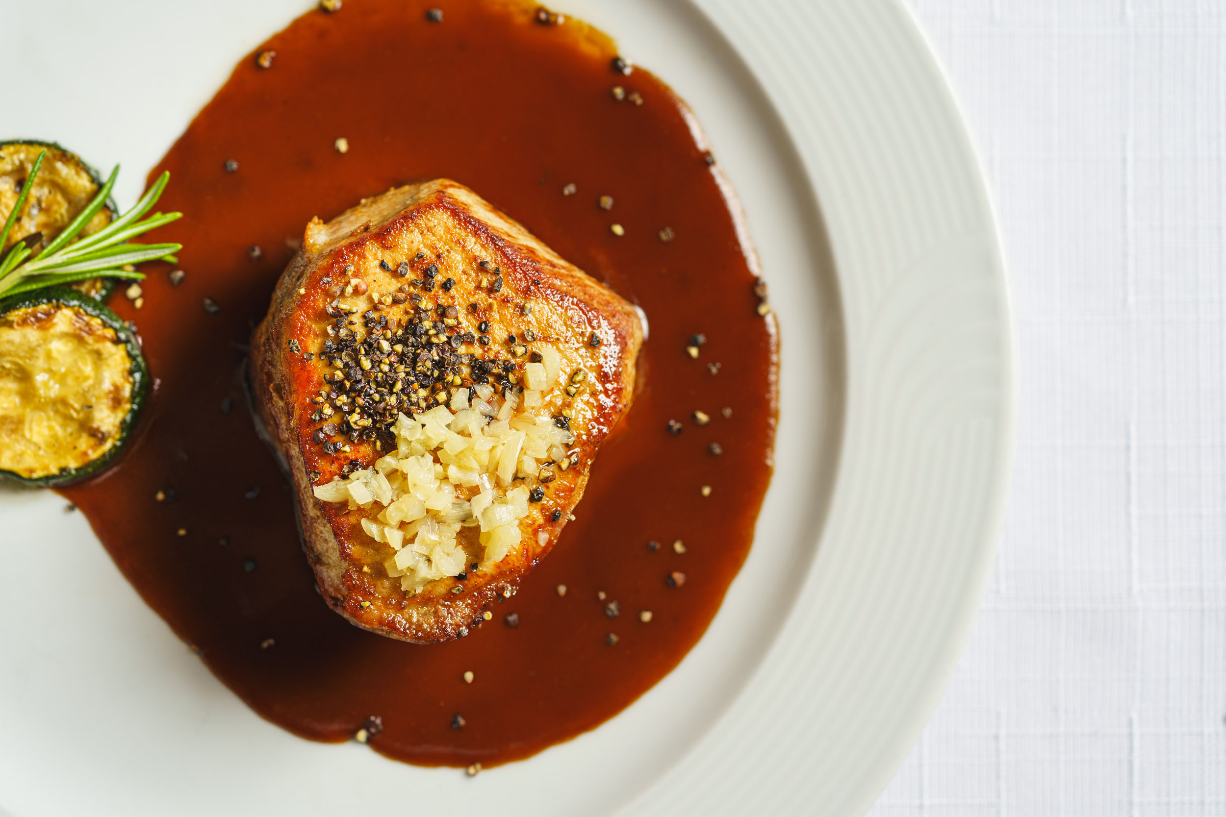 Restaurant: House-style pepper steak with crushed pepper and garlic